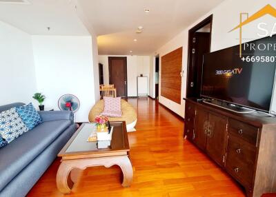 Spacious living room with modern furniture and a flat-screen TV