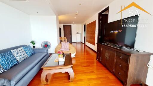 Spacious living room with modern furniture and a flat-screen TV