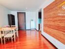 Living area with dining table and wooden flooring