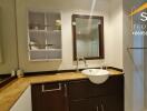 Modern bathroom with sink, mirror, and corner shelf