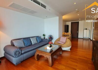 Living room with sofa, coffee table, and TV