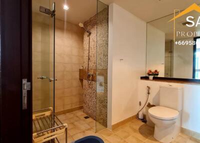 Modern bathroom with glass shower and toilet