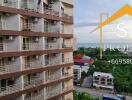 View of apartment building exterior with balconies and air conditioning units