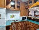 Wooden kitchen with green countertops