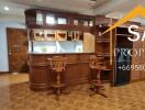 Home bar with wooden furniture and stools in a cozy setting