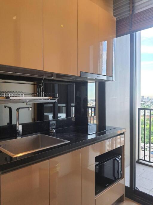 Modern kitchen with city view and balconies