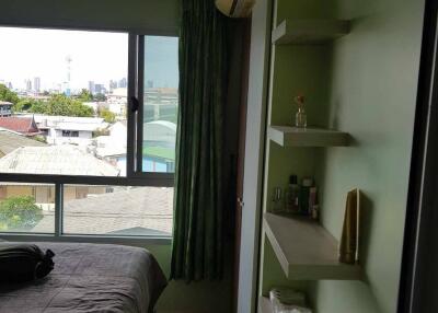 Bedroom with green walls and window view