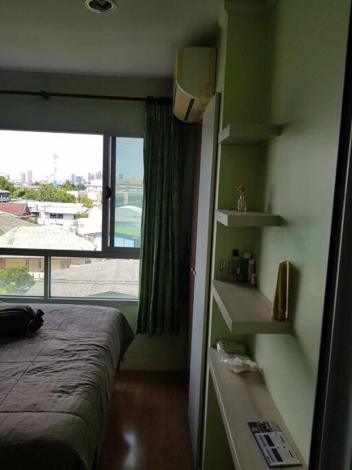 Bedroom with green walls and window view