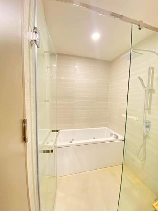 Modern bathroom with glass shower and bathtub