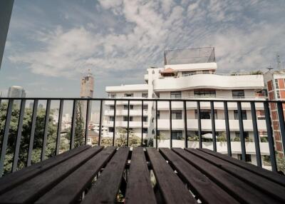 Balcony with a view of buildings and sky