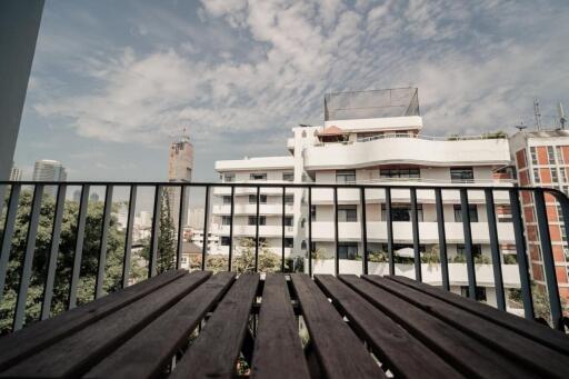 Balcony with a view of buildings and sky