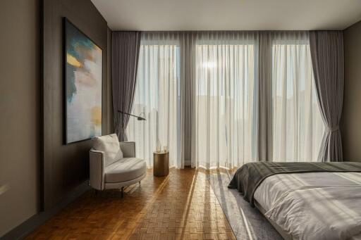 Contemporary bedroom with large windows, modern decor, and ample light