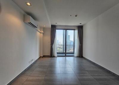 Spacious living room with window view and balcony