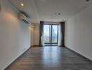 Spacious living room with window view and balcony