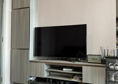 Living room with entertainment center and air conditioning