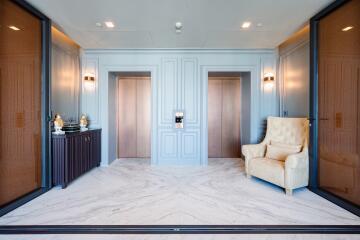 Modern building lobby with elevators and seating area