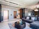 Modern living room with sectional sofa, chandelier, and marbled coffee table