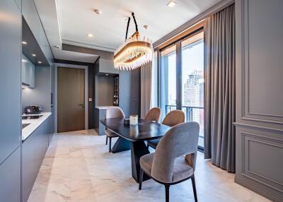 Modern kitchen with dining area and large windows