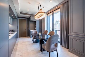 Modern kitchen with dining area and large windows