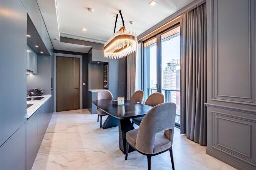 Modern kitchen with dining area and large windows