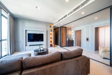 Spacious modern living room with built-in TV and bookshelves