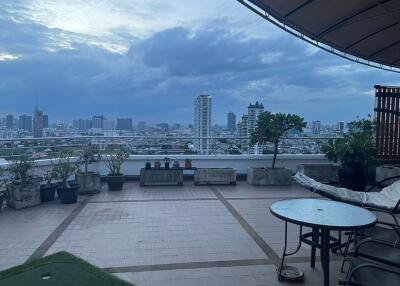 Spacious balcony with city skyline view