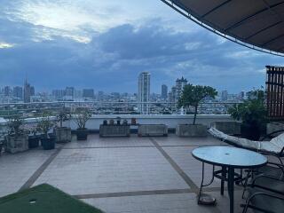 Spacious balcony with city skyline view