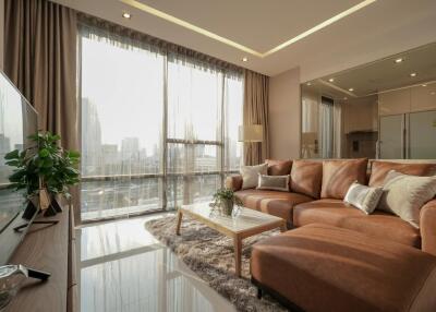 Spacious modern living room with large windows and city view