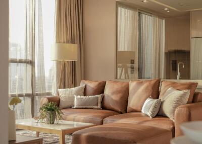 Cozy living room with a leather sofa and natural light