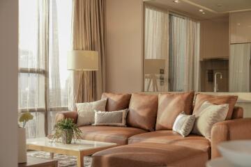 Cozy living room with a leather sofa and natural light