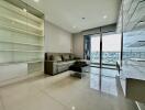 Modern living room with glass doors overlooking cityscape