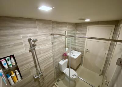 Modern bathroom with shower and vanity unit