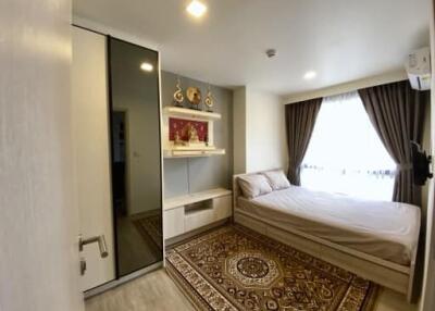 Modern bedroom with bed, wardrobe, and decorative elements