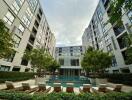 Modern apartment complex with a central pool area