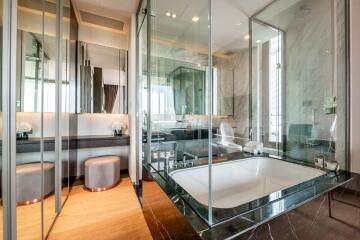 Luxury bathroom with bathtub and glass-enclosed shower area