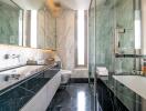 Modern bathroom with marble walls and black countertops