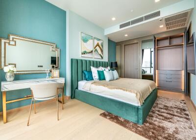 Elegant bedroom with teal decor and modern furnishings