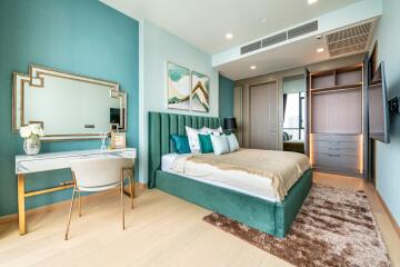 Elegant bedroom with teal decor and modern furnishings