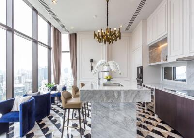 Modern kitchen with marble island and city view