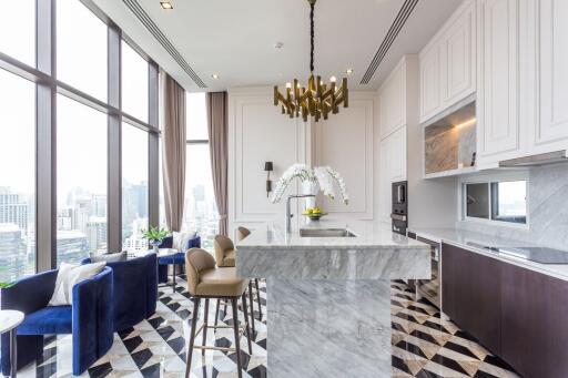 Modern kitchen with marble island and city view