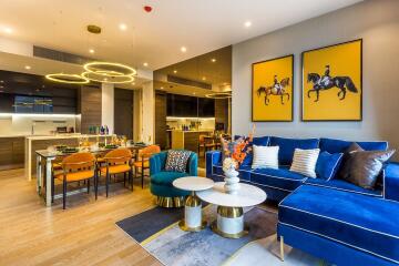 Modern living room and kitchen with blue and yellow decor