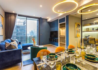 Modern living and dining area with stylish decor and city view