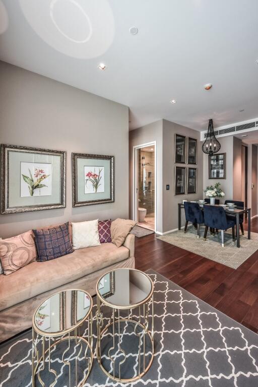 Elegant living room with modern decor and dining area