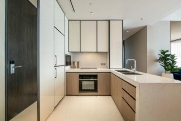 Modern kitchen with white and wood finishes