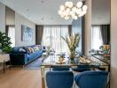 Modern living and dining area with blue sofa and chairs