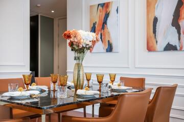 Modern dining room with stylish decor and table setting