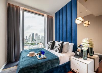 Modern bedroom with large window and city view