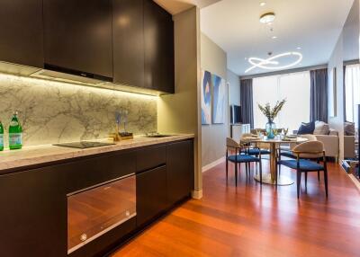 Modern kitchen and living room with dining area