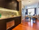 Modern kitchen and living room with dining area