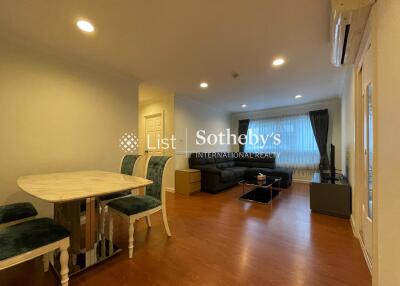 Spacious living room with dining area and large windows